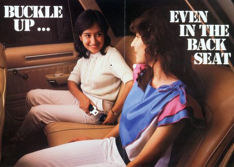 "Buckle up... even in the back seat" 1984 advertisement showing two women buckling seat belts,