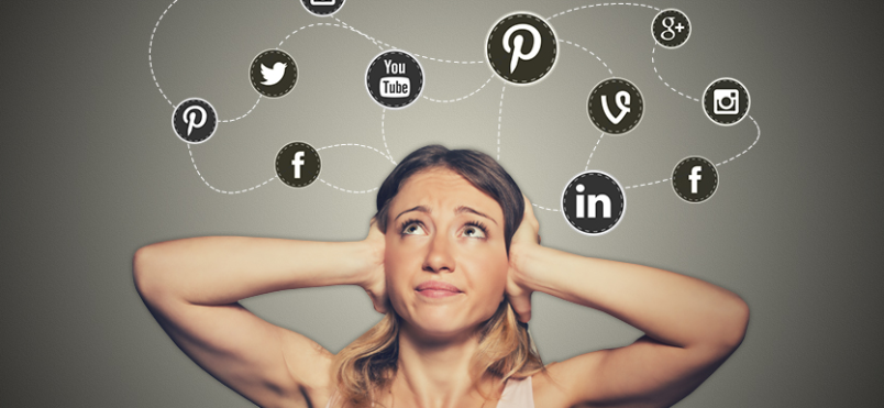 Woman covering her ears with social media icons above head